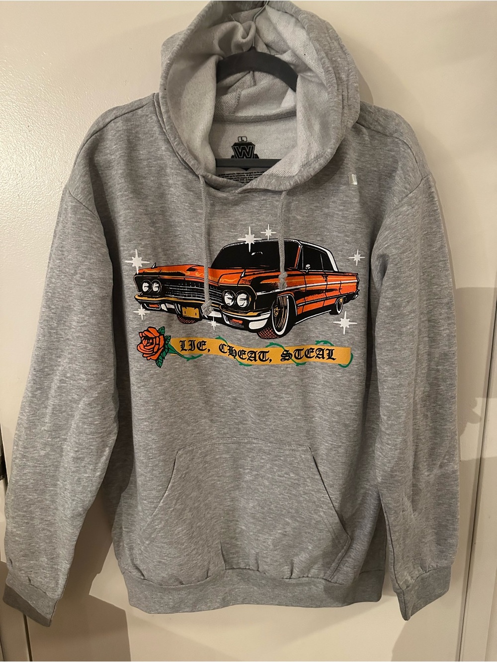 WWE Officials  Latin Heat Pullover Hoodie with Orange Classic Car Graphic.